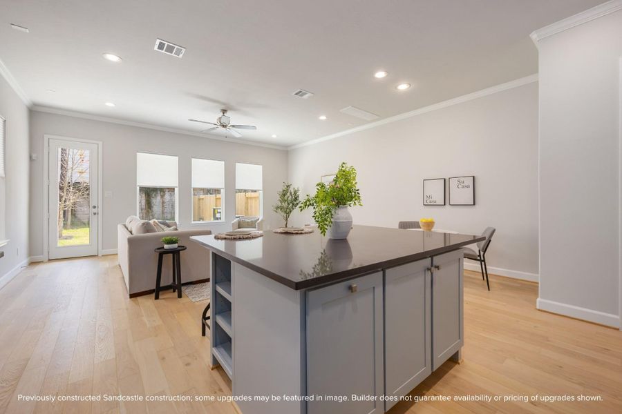 The kitchen's open design seamlessly transitions into the spacious living room, affirming the beauty of an interconnected living space. The kitchen's open design seamlessly transitions into the spacious living room, affirming the beauty of an interconnected living space.
