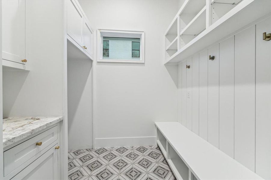 Mud room with custom built-ins for backpacks, second refrigerator and whatever you want to store