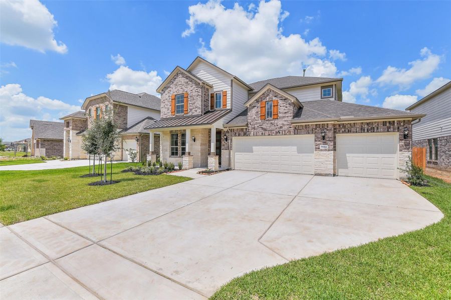 Front exterior of a new home in Stone Creek Ranch, Hockley, TX, highlighting curb appeal (Image 22). Front exterior of a new home in Stone Creek Ranch, Hockley, TX, highlighting curb appeal (Image 22).