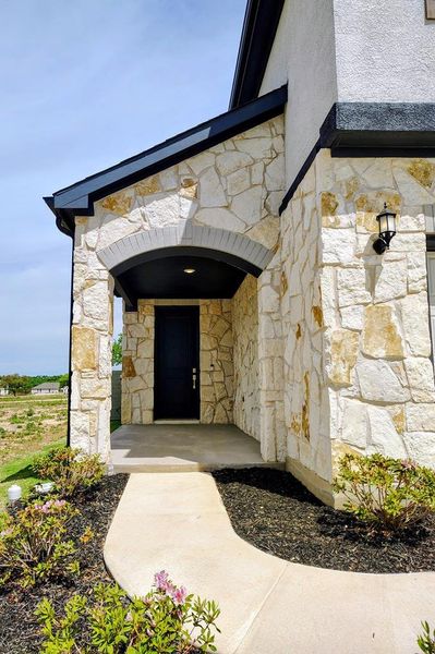 Exterior details and patio area of a home in Wolf Ranch, Georgetown (Image 20).