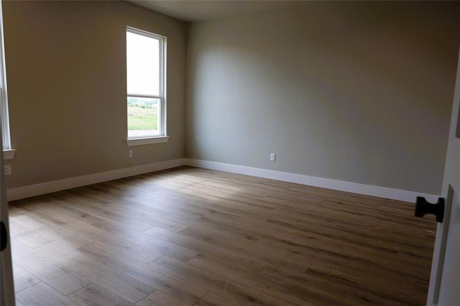 Unfurnished room featuring hardwood / wood-style floors