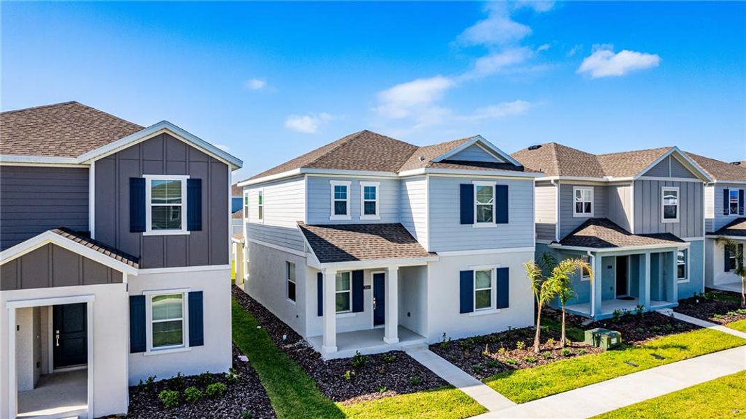 Front exterior of a new home in Wellness Ridge, Clermont, FL, highlighting curb appeal (Image 2).