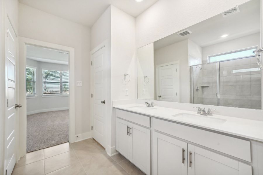 Primary suite bathroom in the Medina floorplan at a Meritage Homes community.