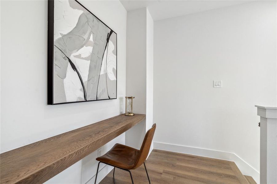 Charming built-in workspace featuring a minimalist wood desk perfect for productivity or creativity.