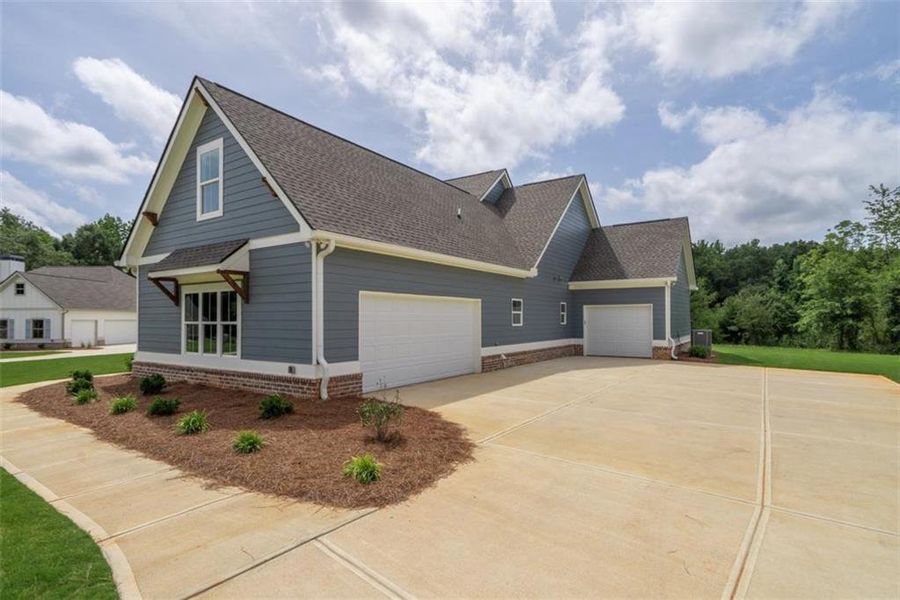 Front exterior of a new home in , Social Circle, GA, highlighting curb appeal (Image 26).