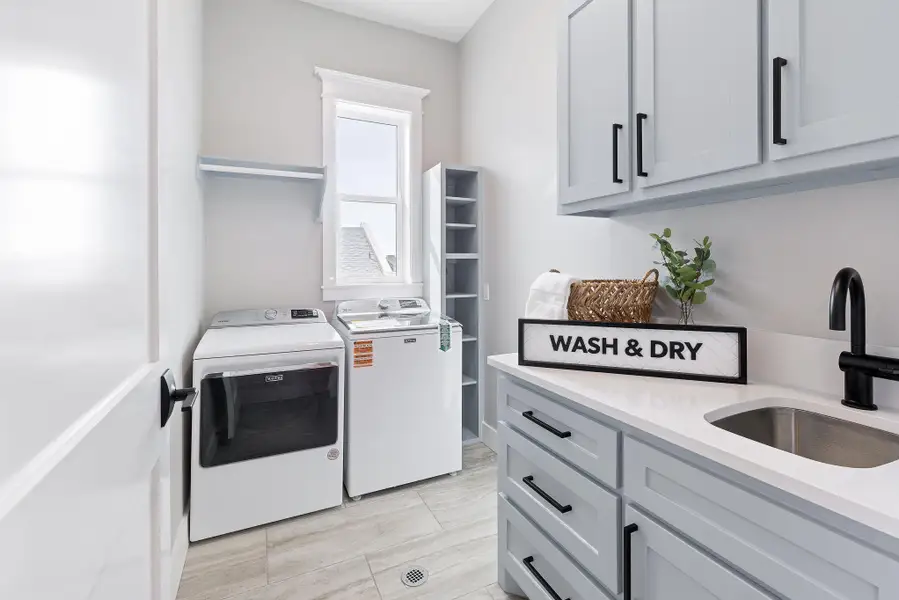 Laundry area featuring washer and dryer and cabinet space Laundry area featuring washer and dryer and cabinet space