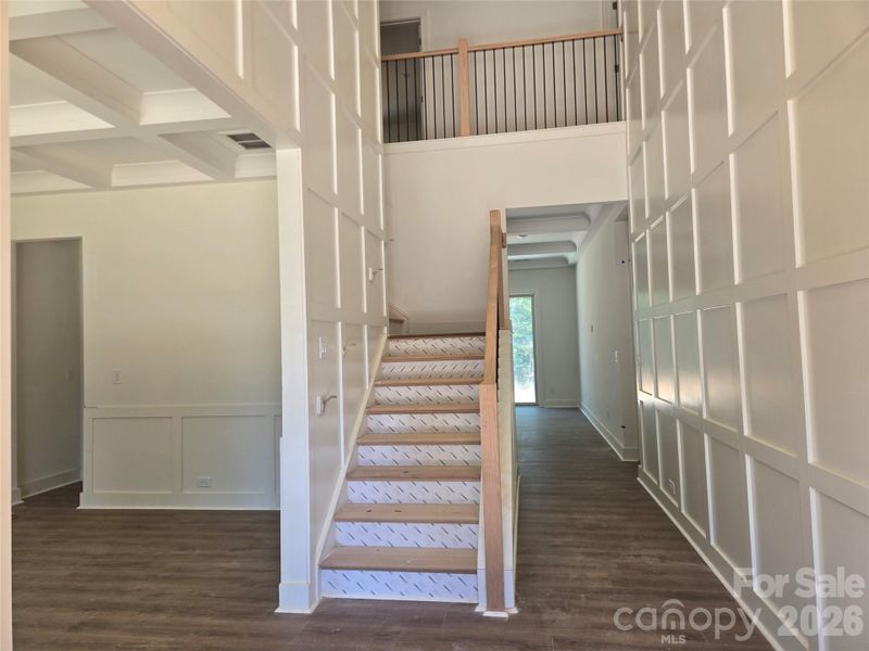 Flanked by the formal dining room and a grand wooden staircase. Flanked by the formal dining room and a grand wooden staircase.