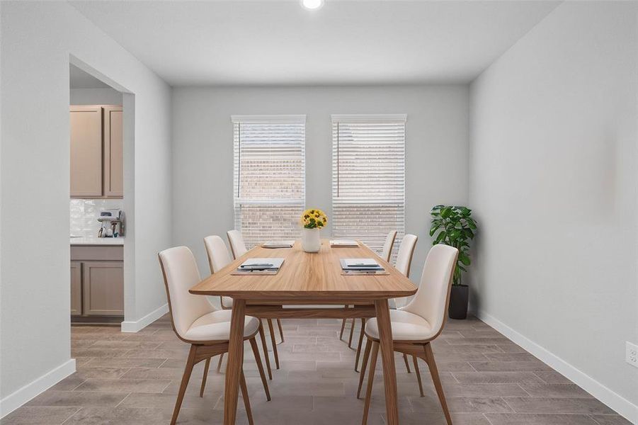 You and your guests will certainly dine in style in this amazing formal dining room! Featuring large windows with blinds, neutral paint, high ceilings, and tile flooring! Perfect space to entertain family and friends!