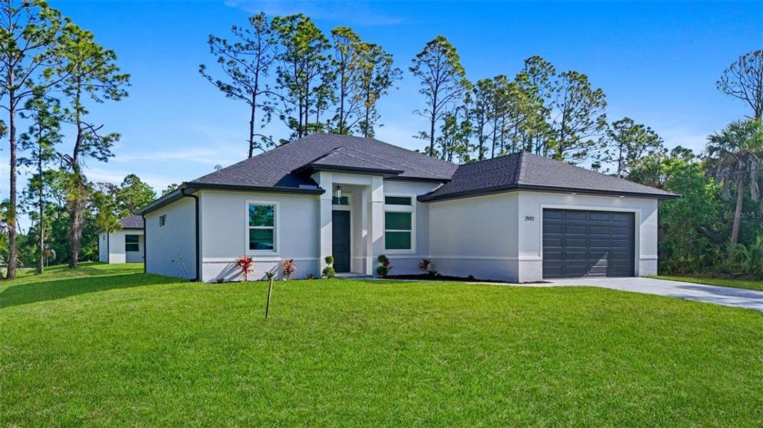 Front exterior of a new home in , North Port, FL, highlighting curb appeal (Image 22).
