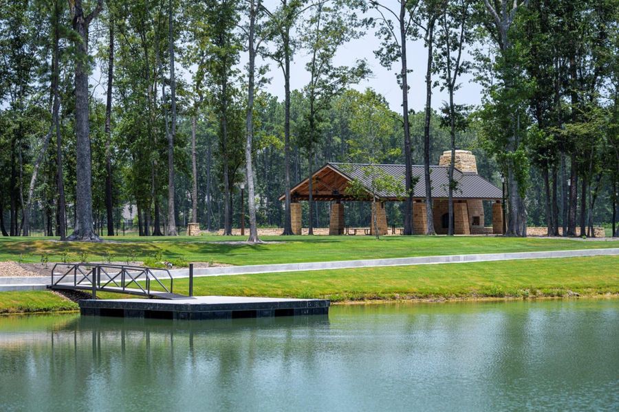 Mirror Lake Park offers a playground, sports field, nature trails, a covered pavilion, a fishing dock, and direct lake access for paddleboarding and kayaking.