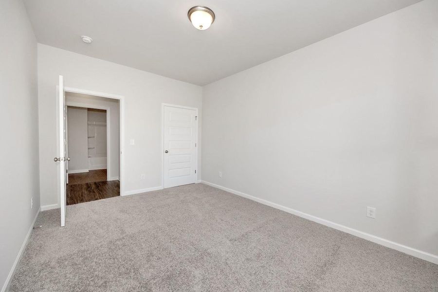 The Avery- Bedroom 2. Home under construction. Sample floor plan photo used for illustrative purposes only. Upgrades, selections options, and colors will vary.