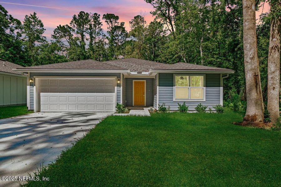 Front exterior of a new home in , Jacksonville, FL, highlighting curb appeal (Image 22).