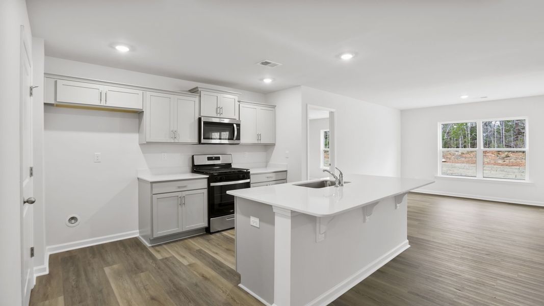 Furnished interior view inside a new home in Bentley Park, Greenwood (Image 5).