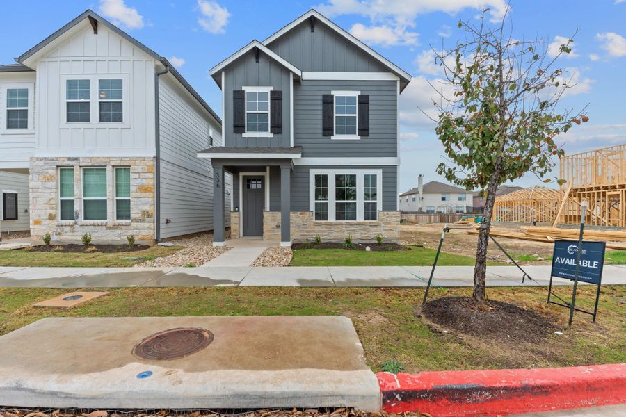 Front exterior of a new home in Retreat at Hero Way, Leander, TX, highlighting curb appeal (Image 2).