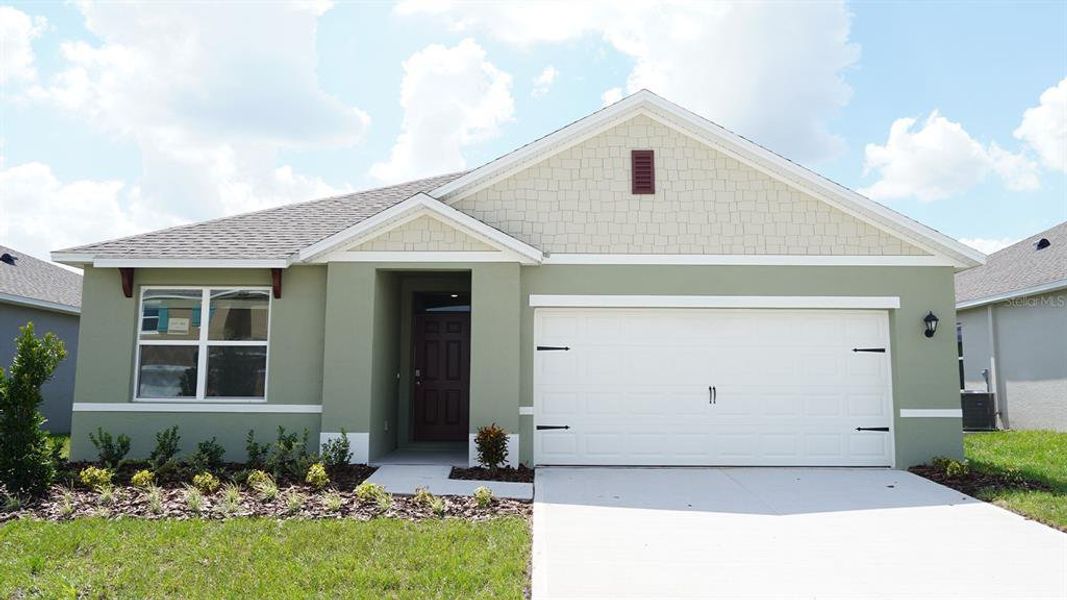 Front exterior of a new home in Crosswinds, Haines City, FL, highlighting curb appeal (Image 1). Front exterior of a new home in Crosswinds, Haines City, FL, highlighting curb appeal (Image 1).