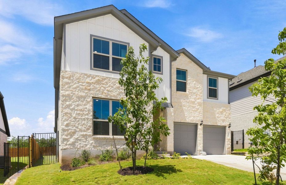 Front exterior of a new home in Saddleback at Santa Rita Ranch, Liberty Hill, TX, highlighting curb appeal (Image 22).