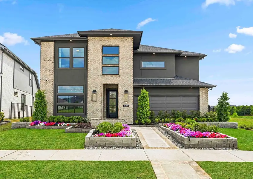 Front exterior of a new home in Bridgeland 45', 50', 70', Cypress, TX, highlighting curb appeal (Image 2).