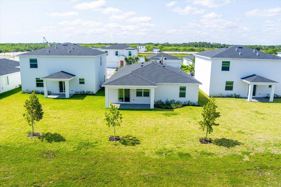 Front exterior of a new home in Seagrove: The Indies, Fort Pierce, FL, highlighting curb appeal (Image 27).