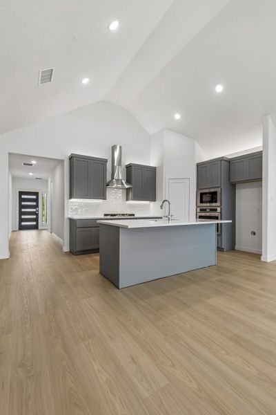 Kitchen in the Claret home plan by Trophy Signature Homes – REPRESENTATIVE PHOTO