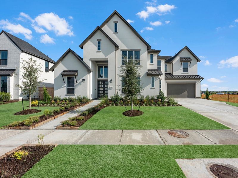 Front exterior of a new home in Sienna 80′, Missouri City, TX, highlighting curb appeal (Image 2). Front exterior of a new home in Sienna 80′, Missouri City, TX, highlighting curb appeal (Image 2).