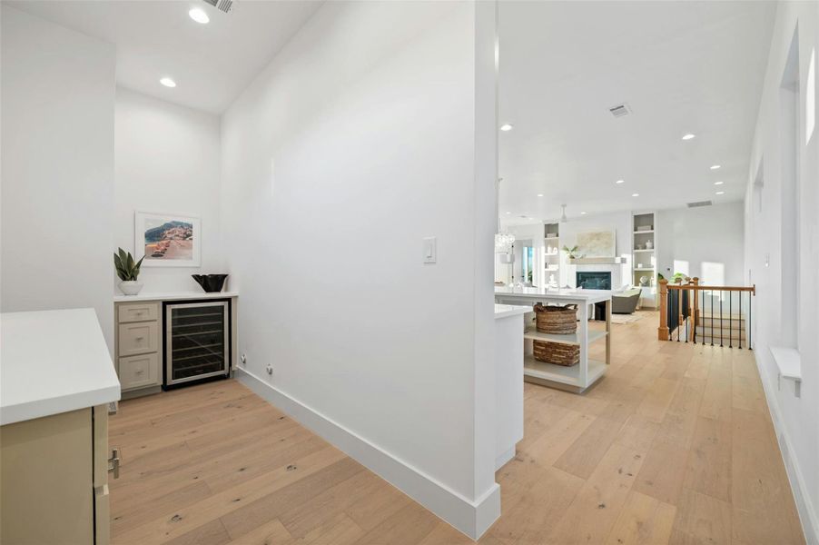 The kitchen also boasts a butler's pantry area equipped with a cafe counter and a wet bar with a wine fridge. there is also a huge walk-in pantry room behind a sliding barn door (take the tour to see more pics).