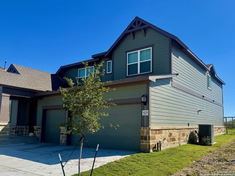 Front exterior of a new home in The Crossvine 55’, Schertz, TX, highlighting curb appeal (Image 21).