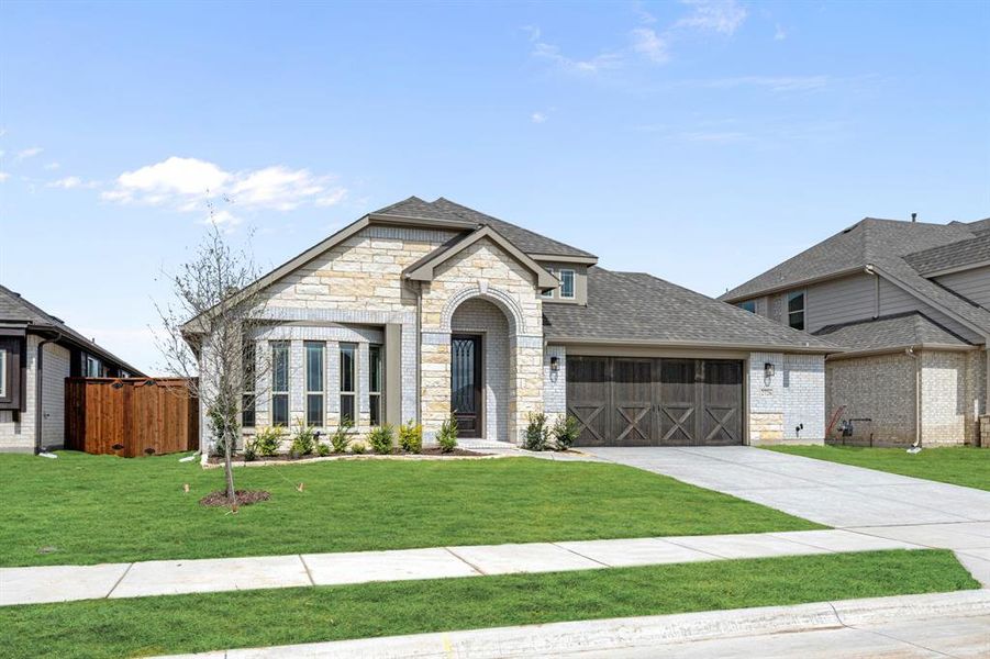 Front exterior of a new home in Meraki, Forney, TX, highlighting curb appeal (Image 2).