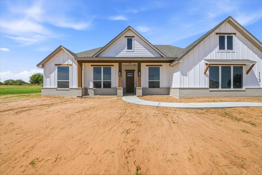 Front exterior of a new home in Zion Valley, Poolville, TX, highlighting curb appeal (Image 2).