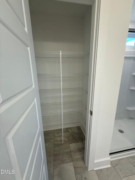 Lot 28 Primary bath linen closet Lot 28 Primary bath linen closet