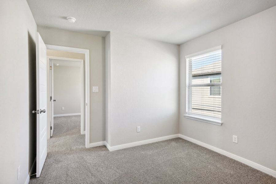 Guest bedroom in the Medina floorplan at a Meritage Homes community.