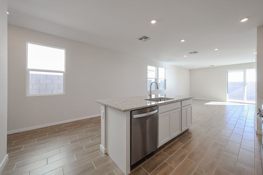 A kitchen with a large island. A kitchen with a large island.