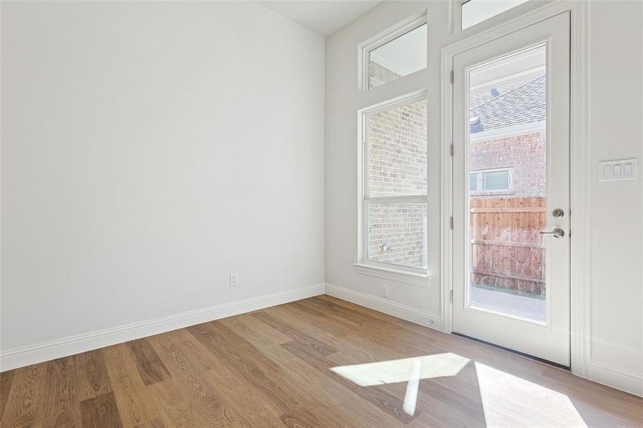 Doorway to outside featuring light wood-type flooring