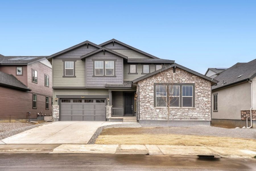 Front exterior of a new home in Red Rocks Ranch, Morrison, CO, highlighting curb appeal (Image 1). Front exterior of a new home in Red Rocks Ranch, Morrison, CO, highlighting curb appeal (Image 1).