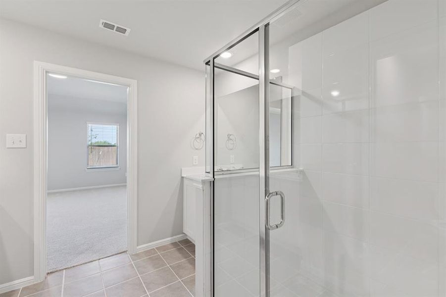 Primary Bathroom in the Harrison home plan by Trophy Signature Homes – REPRESENTATIVE PHOTO Primary Bathroom in the Harrison home plan by Trophy Signature Homes – REPRESENTATIVE PHOTO