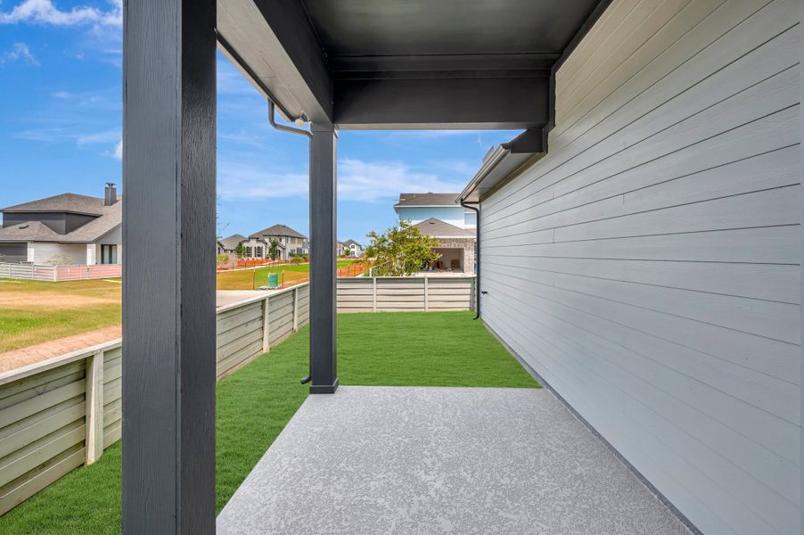 Exterior details and patio area of a home in Pomona - Grove Row Collection, Manvel (Image 3).