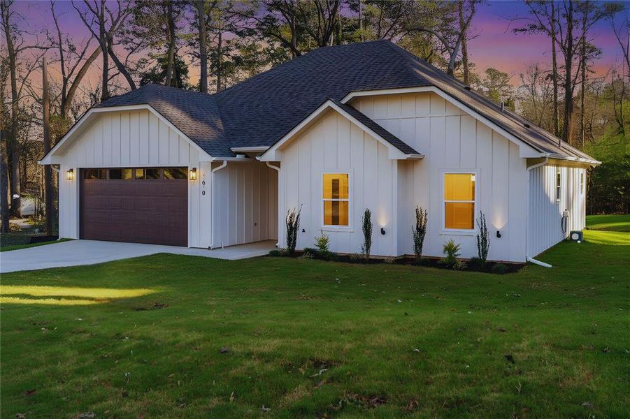 Front exterior of a new home in , Hideaway, TX, highlighting curb appeal (Image 23).