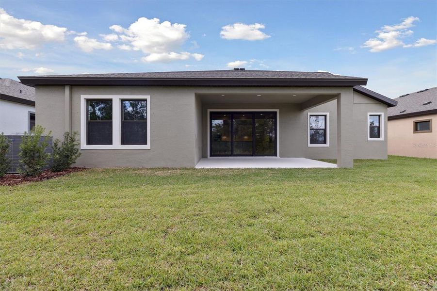 Exterior details and patio area of a home in Caldera, Spring Hill (Image 18).
