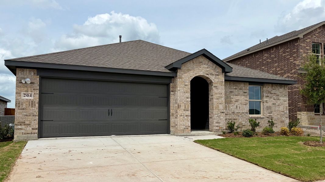 Front exterior of a new home in Northspur, Terrell, TX, highlighting curb appeal (Image 1). Front exterior of a new home in Northspur, Terrell, TX, highlighting curb appeal (Image 1).