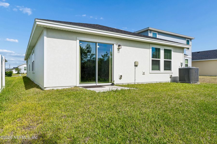 Exterior details and patio area of a home in Lakes at Bella Lago – Classic Series, Green Cove Springs (Image 21).