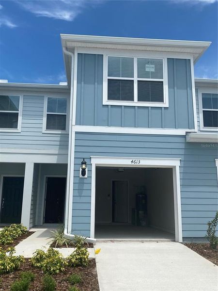 Front exterior of a new home in , Kissimmee, FL, highlighting curb appeal (Image 2).