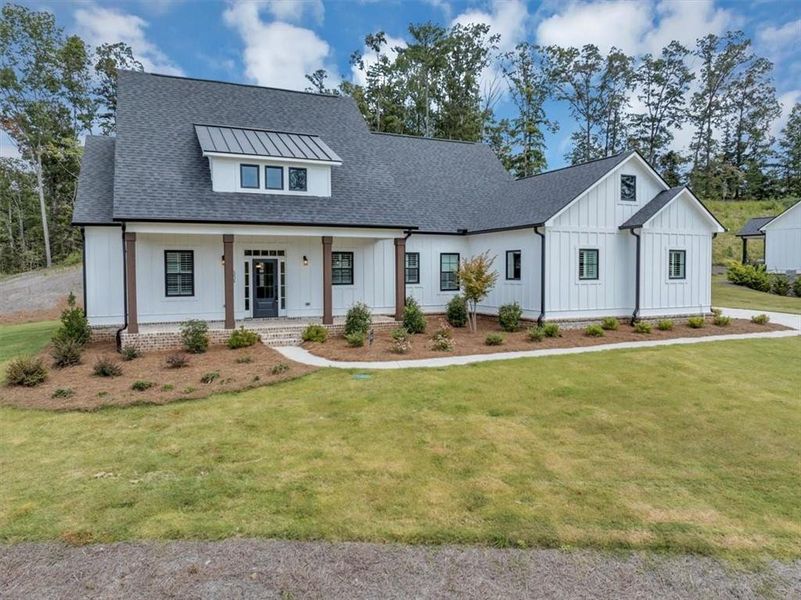 Front exterior of a new home in , Ball Ground, GA, highlighting curb appeal (Image 24).