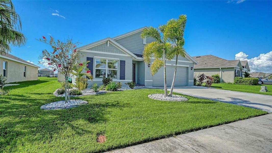Front exterior of a new home in Bella Lago, Parrish, FL, highlighting curb appeal (Image 28). Front exterior of a new home in Bella Lago, Parrish, FL, highlighting curb appeal (Image 28).