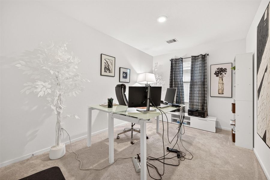 This is the first bedroom to the right of the living room. It's currently being used as an office. This is the first bedroom to the right of the living room. It's currently being used as an office.