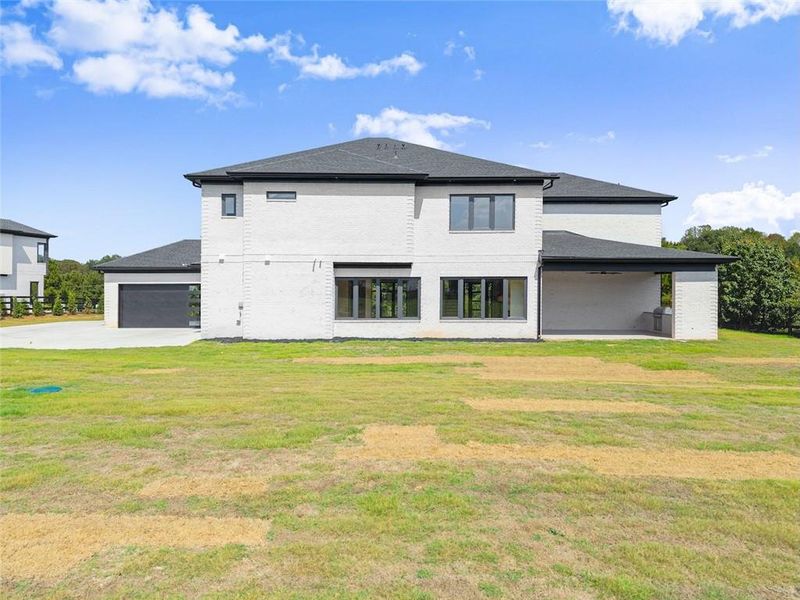 Front exterior of a new home in , Dacula, GA, highlighting curb appeal (Image 23).
