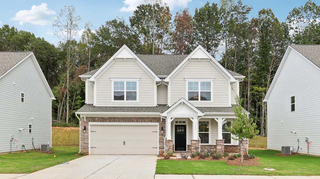 Front exterior of a new home in Sylvan Creek, Denver, NC, highlighting curb appeal (Image 1). Front exterior of a new home in Sylvan Creek, Denver, NC, highlighting curb appeal (Image 1).