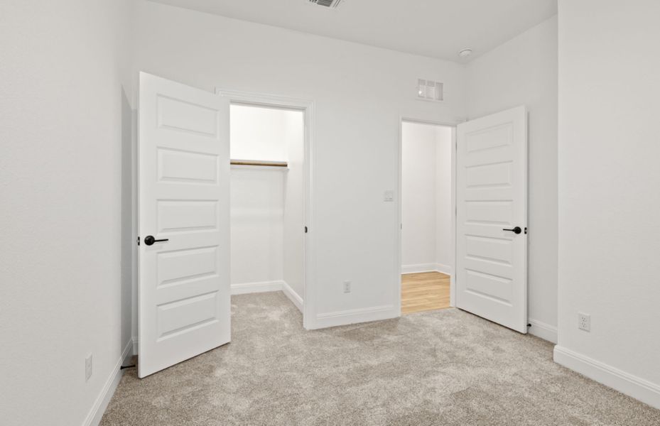 Representative unfurnished interior of a home built from the Burnet by Pulte Homes in Crosswinds, Kyle (Image 13).