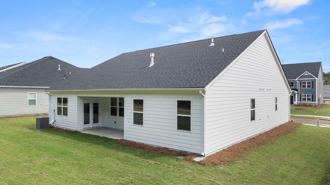 Exterior details and patio area of a home in Preserve at Dove Creek, Statham (Image 4).