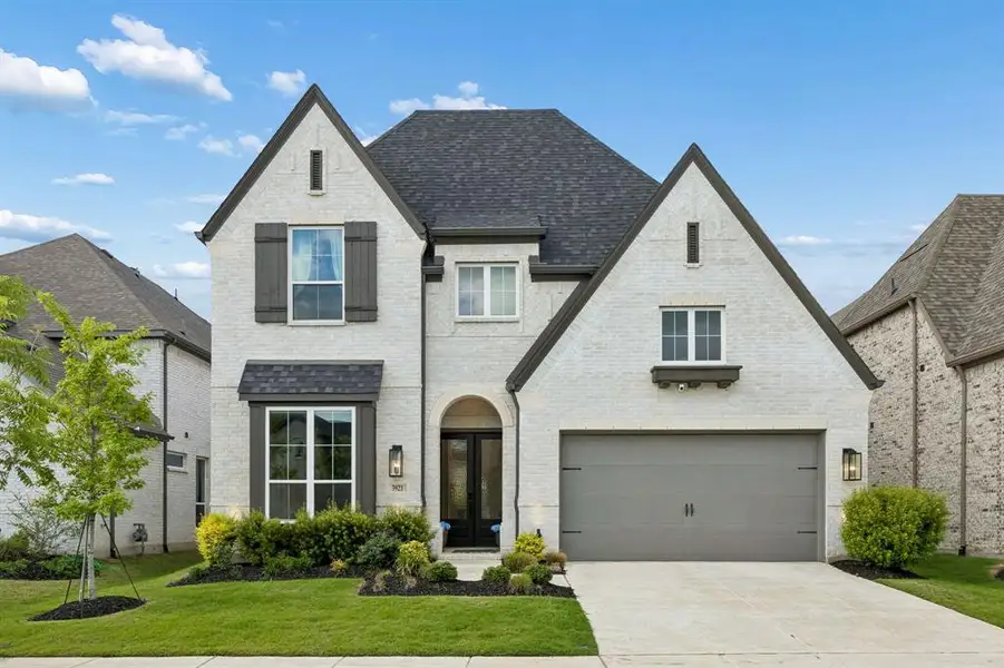 Front exterior of a new home in Mosaic, Celina, TX, highlighting curb appeal (Image 1). Front exterior of a new home in Mosaic, Celina, TX, highlighting curb appeal (Image 1).