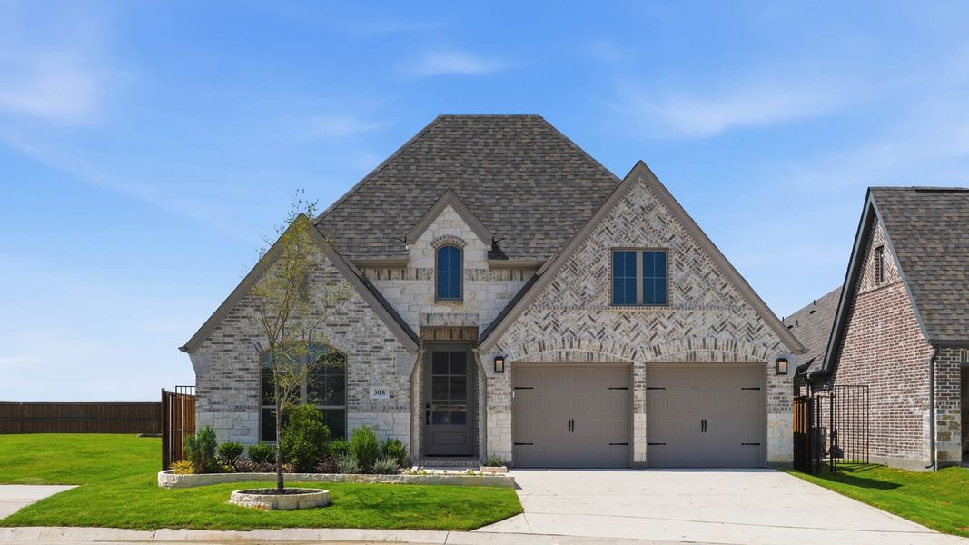 Front exterior of a new home in Lakewood Village, Lakewood Village, TX, highlighting curb appeal (Image 1). Front exterior of a new home in Lakewood Village, Lakewood Village, TX, highlighting curb appeal (Image 1).