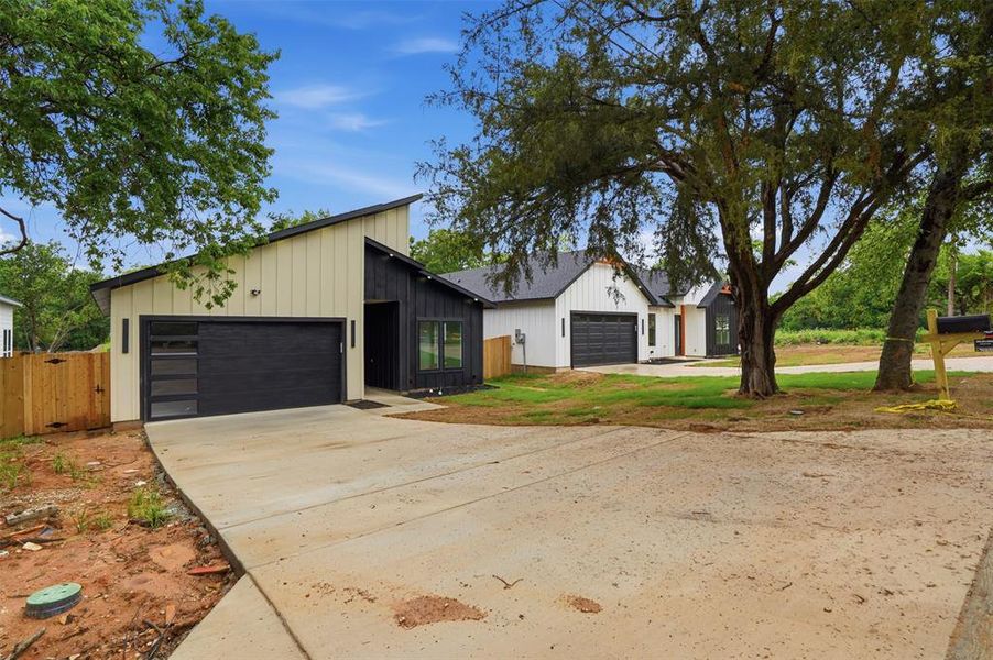 Modern architectural style with a black and white vertical board-and-batten exterior